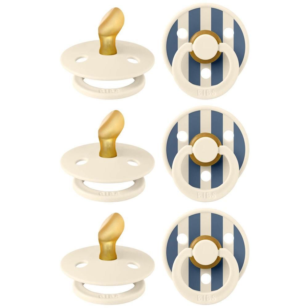 Drie BIBS spenen: twee effen crème, één met blauw-witte strepen en crème handvat.