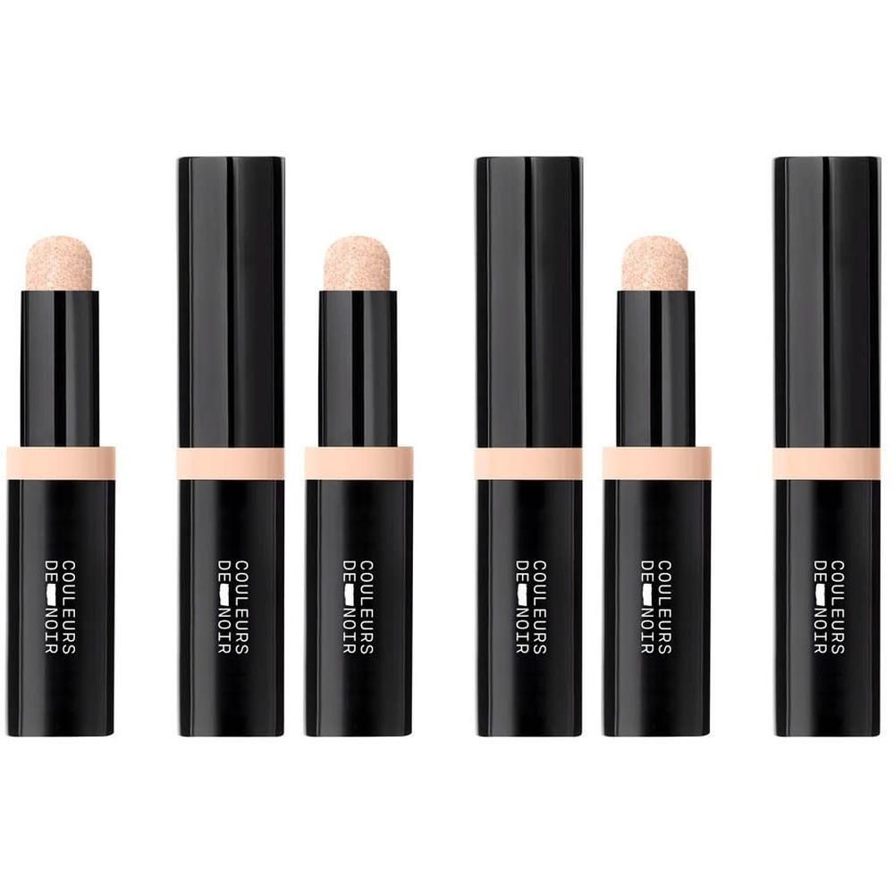 Vijf zwarte sticks met lichtbeige applicator en lichtbeige dop. Tekst: COULEURS DE NOIR.