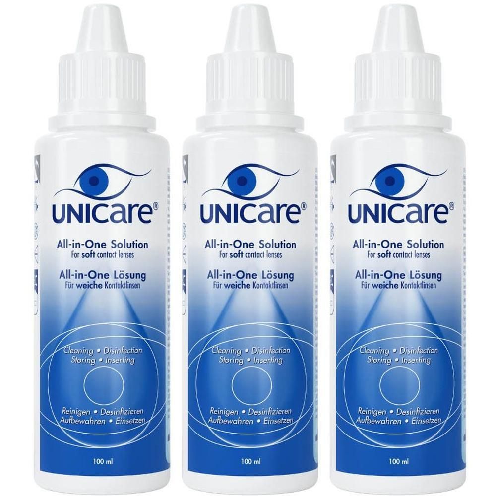 Trois flacons de solution tout-en-un Unicare pour lentilles de contact souples.