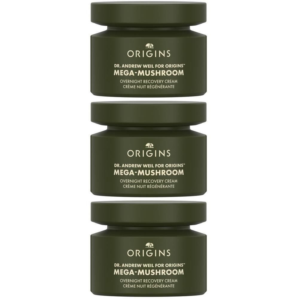 Trois pots verts de la crème de récupération de nuit Mega Mushroom d'Origins.