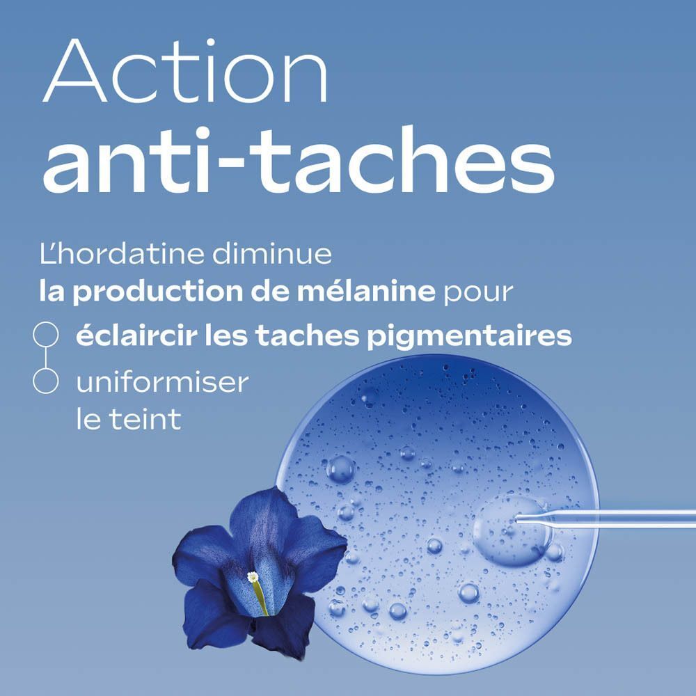 Action anti-taches : fleur bleue et gouttes de sérum.