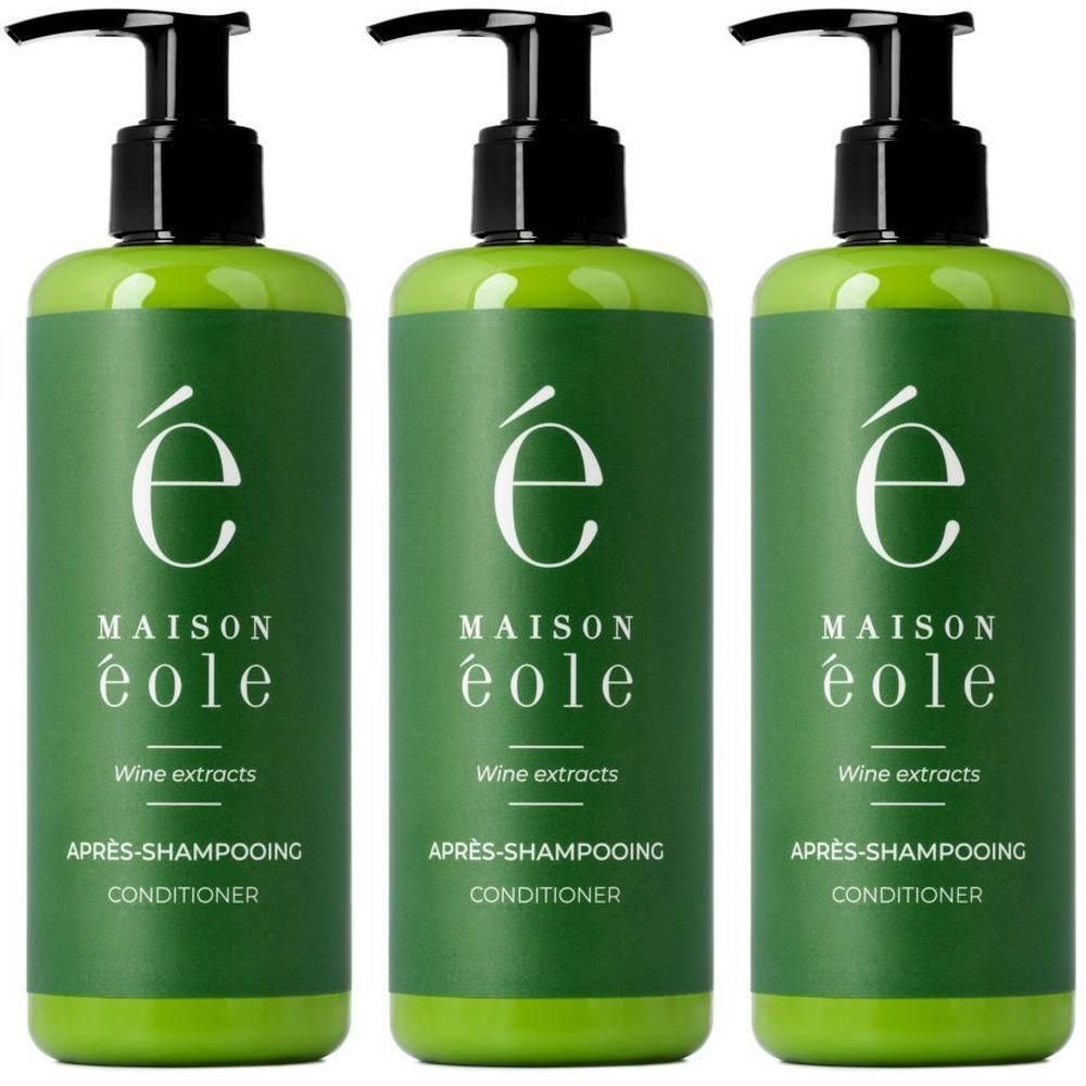 Drie groene flessen Maison Éole Après-shampooing Conditioner met pompdoseringen.