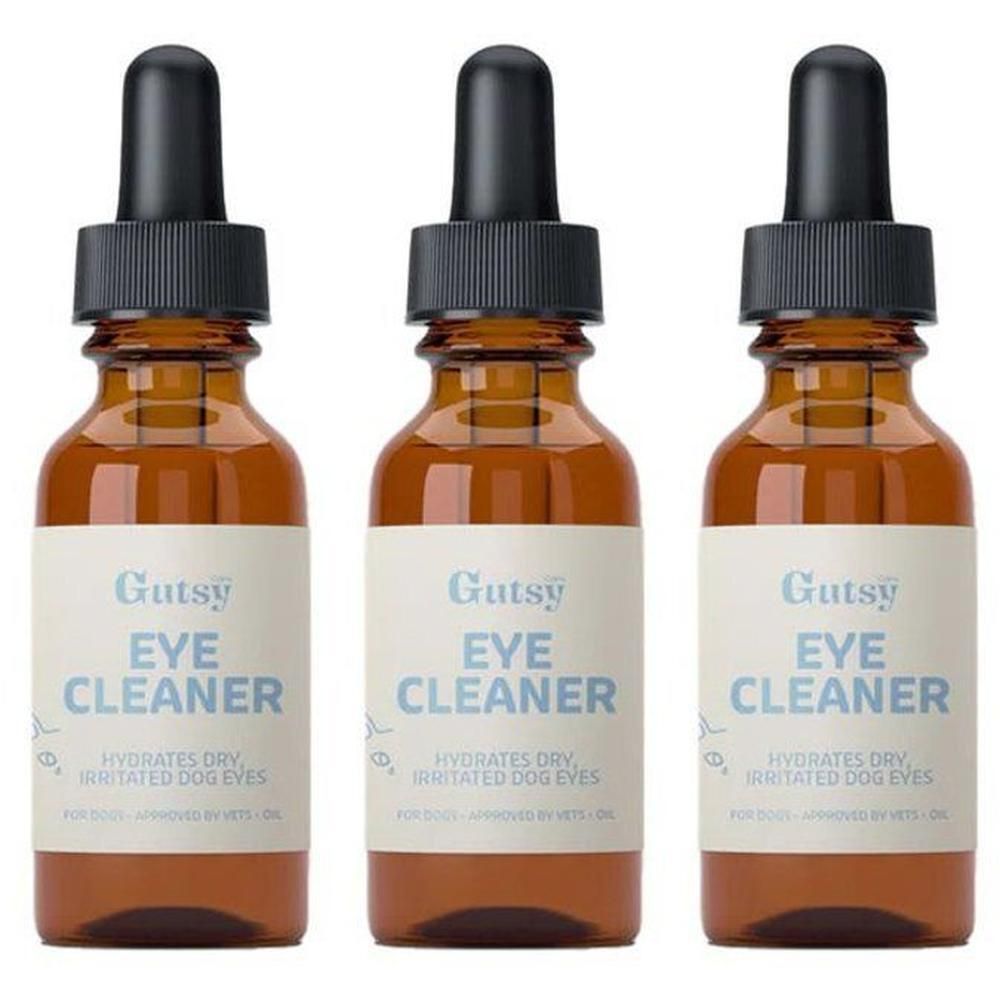 Trois flacons en verre brun avec compte-gouttes, chacun étiqueté pour nettoyant pour les yeux de chien.