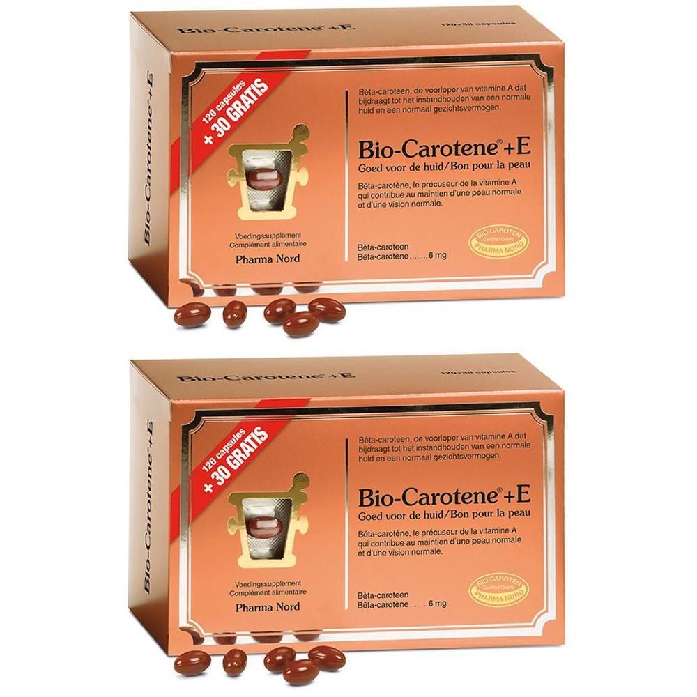 Twee pakken Pharma Nord Bio-Carotene+E capsules, met 120 + 30 gratis capsules. Bruine capsules liggen voor de pakken.