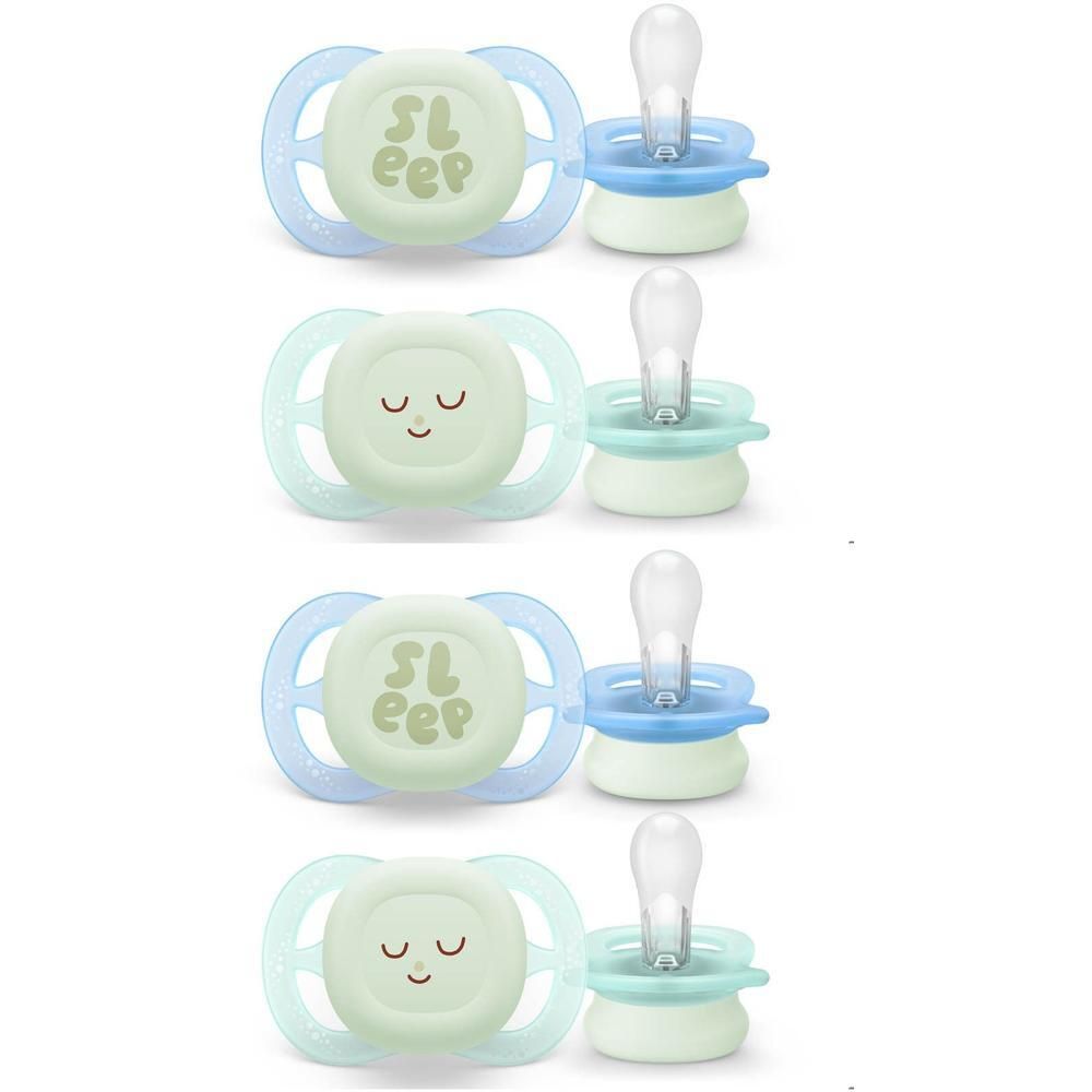 Quatre sucettes Philips Avent avec inscription "Sleep" et visages mignons.