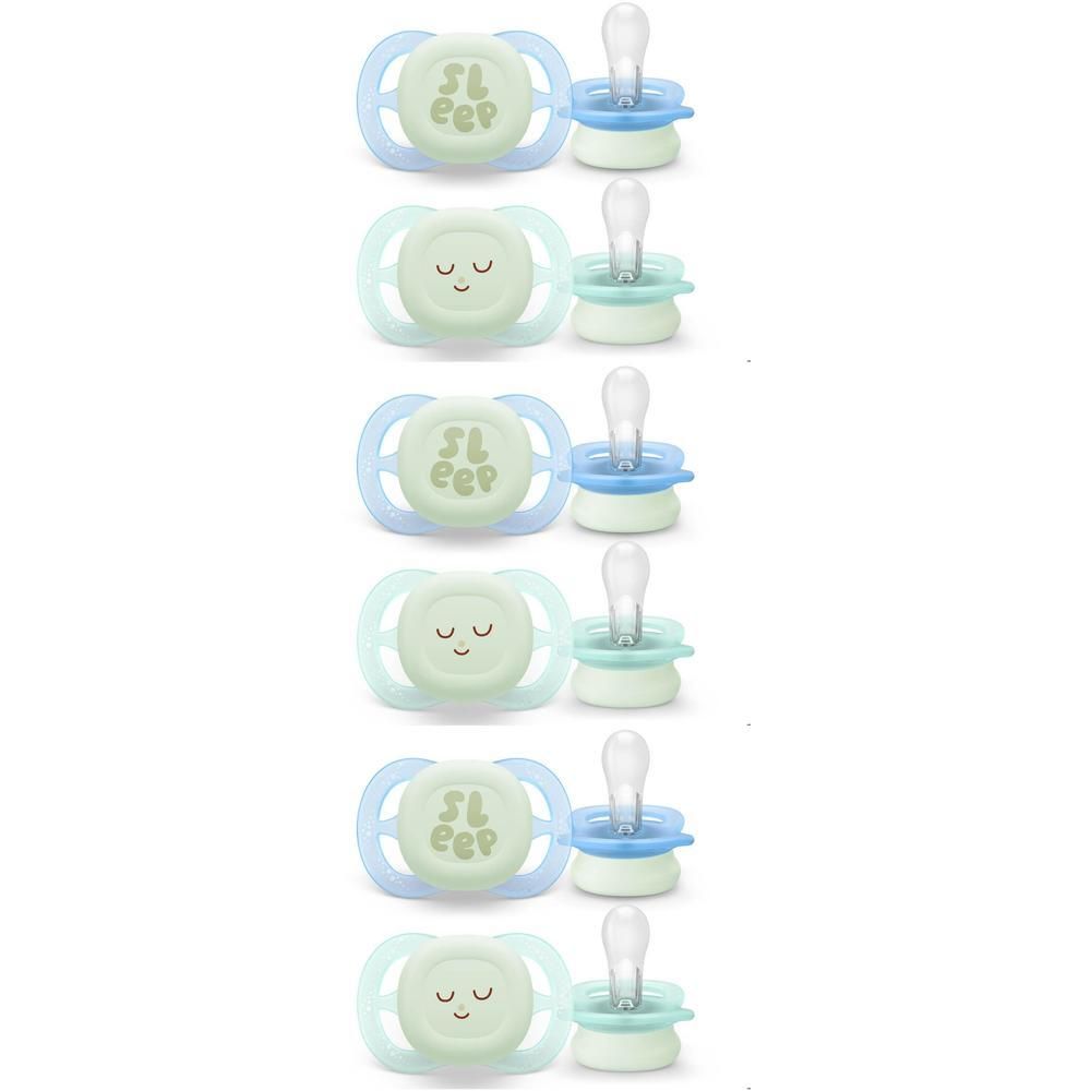 Six sucettes avec visages lumineux et capuchons de protection.
