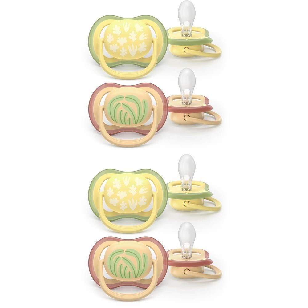 Quatre sucettes aux tons jaunes et roses avec motifs feuilles et herbe.