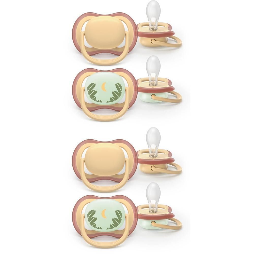 Quatre sucettes Philips Avent : deux avec bouclier jaune, deux avec bouclier vert et motif grenouille.