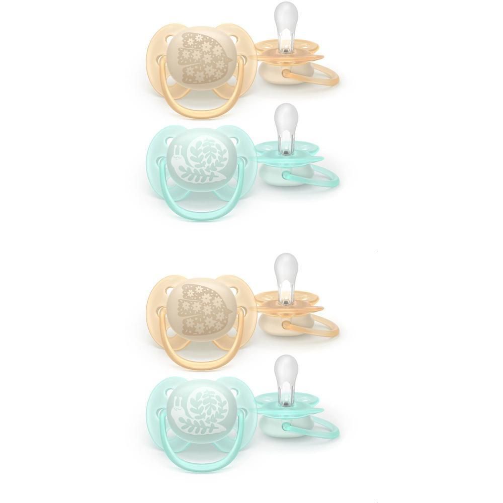 Quatre sucettes de couleur beige et vert menthe avec des motifs d'animaux.