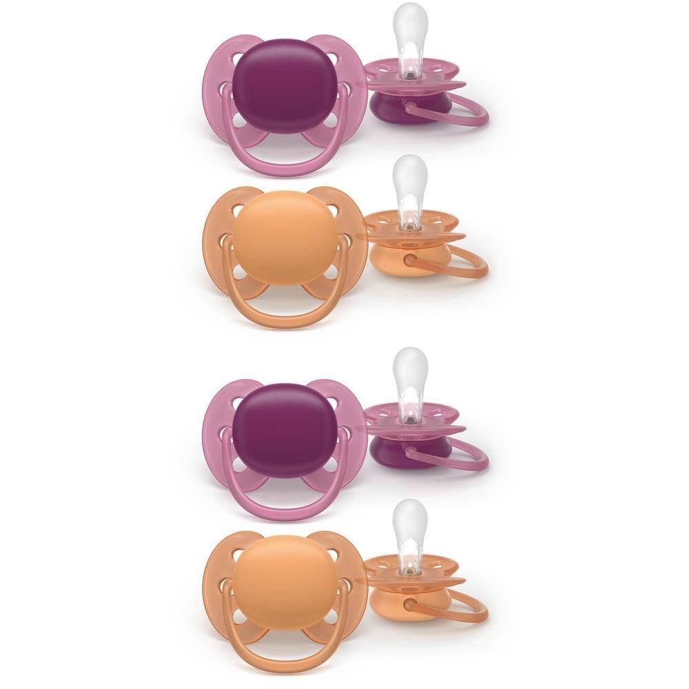 Vier Philips Avent fopspenen: twee fuchsia, twee perzik. Met ventilatiegaten.