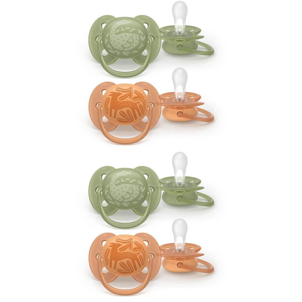 Quatre sucettes vert et orange avec motif animal.