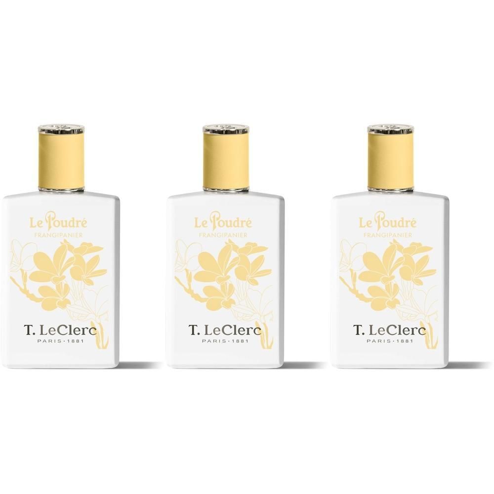 Drie witte flacons met gele bloemmotieven en gouden doppen.