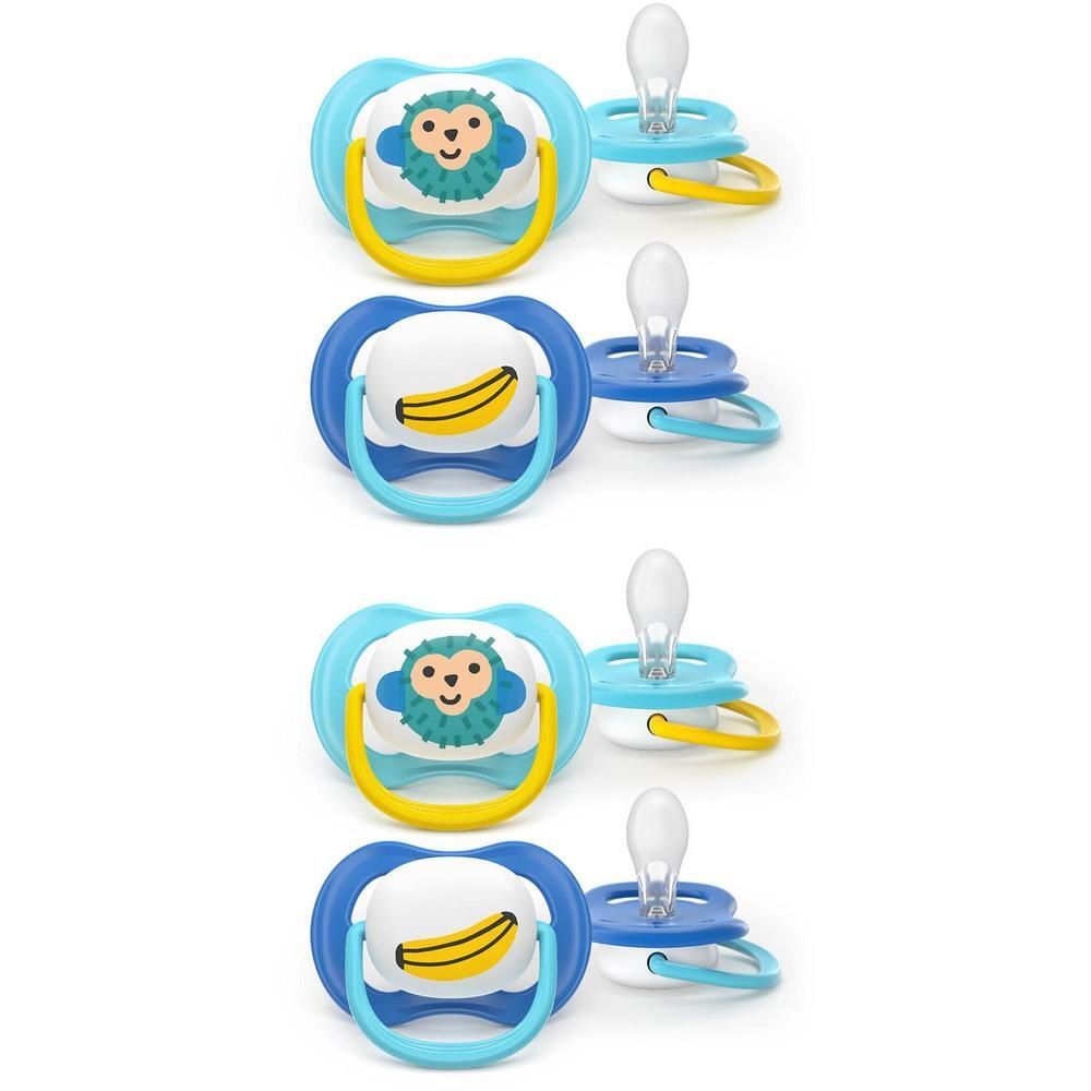 Twee blauwe fopspenen met apenmotief en twee met bananmotief. Voor baby's vanaf 6 maanden.