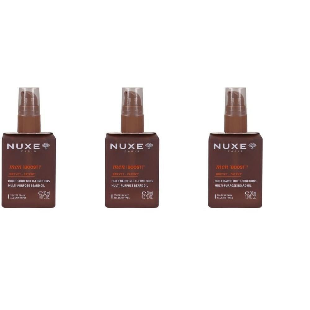 Trois flacons d'huile à barbe Nuxe Men Boost avec distributeurs à pompe.