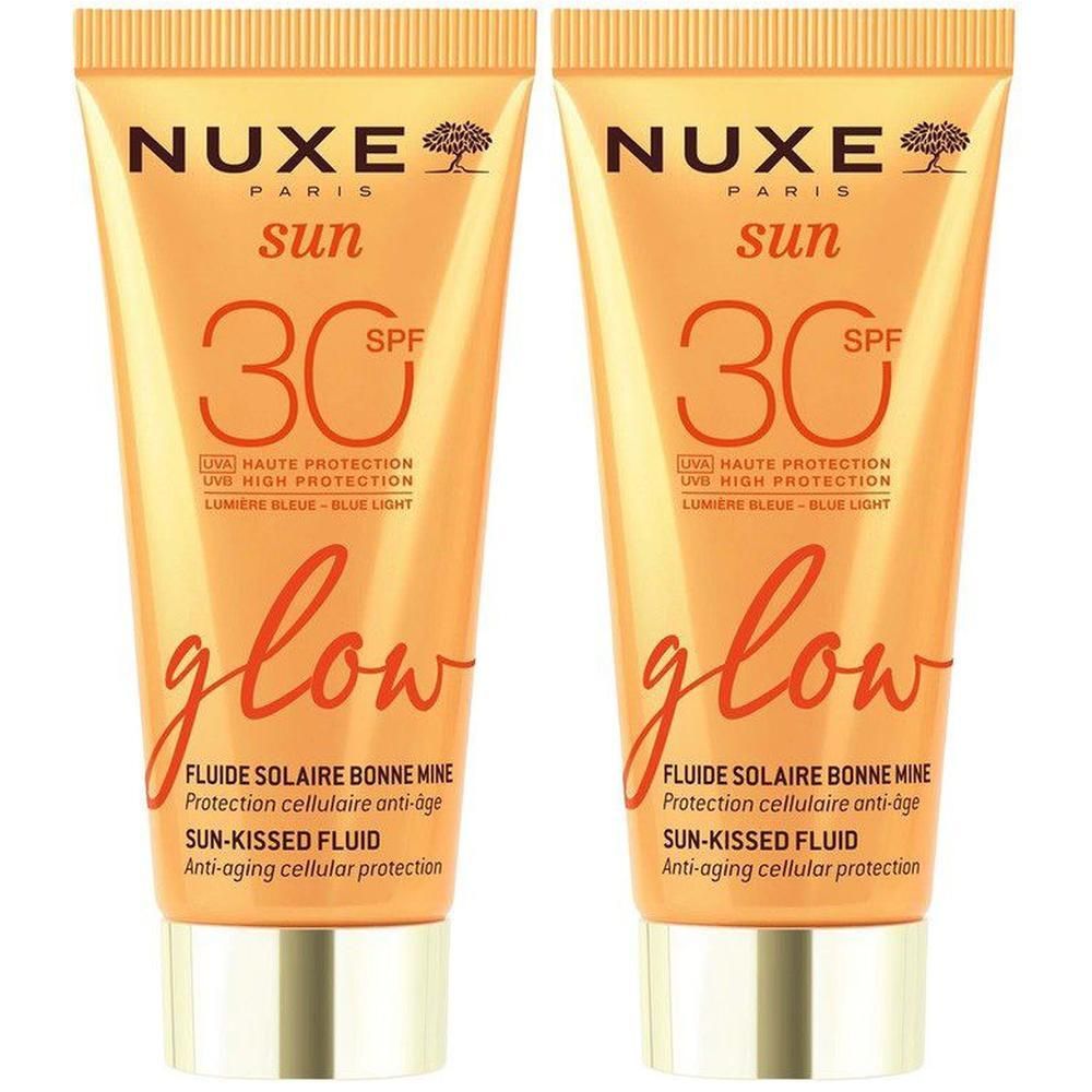 Deux tubes Nuxe Sun Fluide Solaire Bonne Mine SPF30 Glow avec bouchon doré.