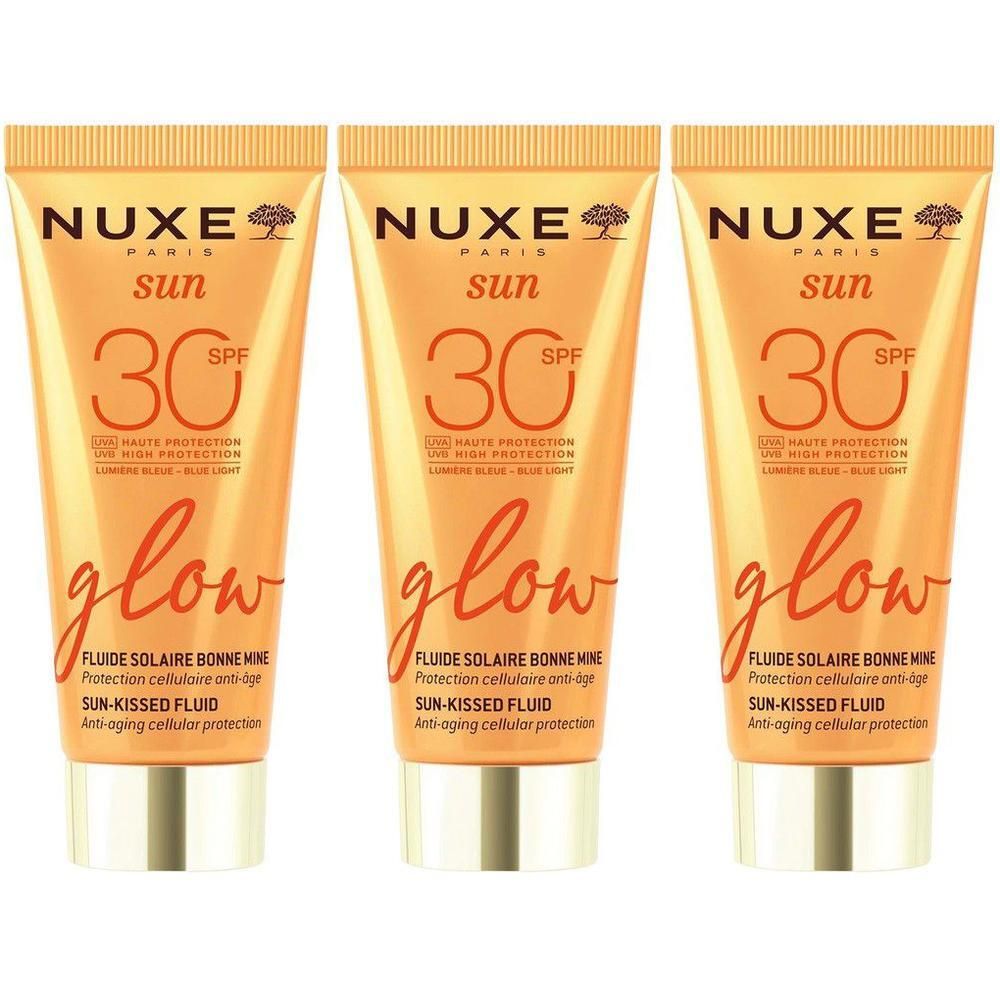 Drie Nuxe Sun Fluide Solaire Bonne Mine SPF30 Glow tubes met gouden dop.