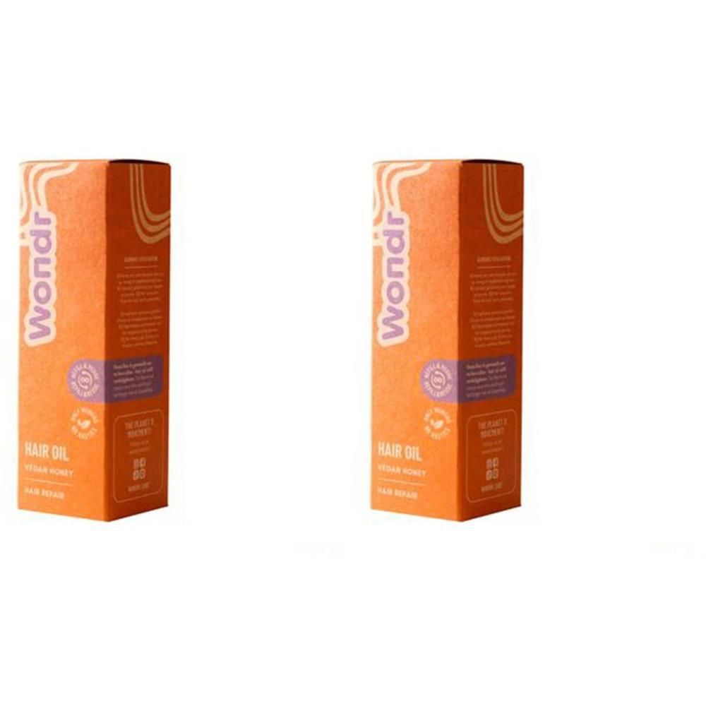 Twee oranje dozen voor Wondr Hair Oil, naast elkaar op witte achtergrond.