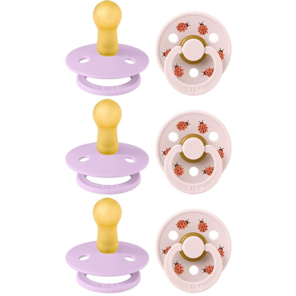 Trois sucettes rondes violettes ciel avec tétine jaune et trois sucettes rondes rose avec motif coccinelle et tétine jaune.