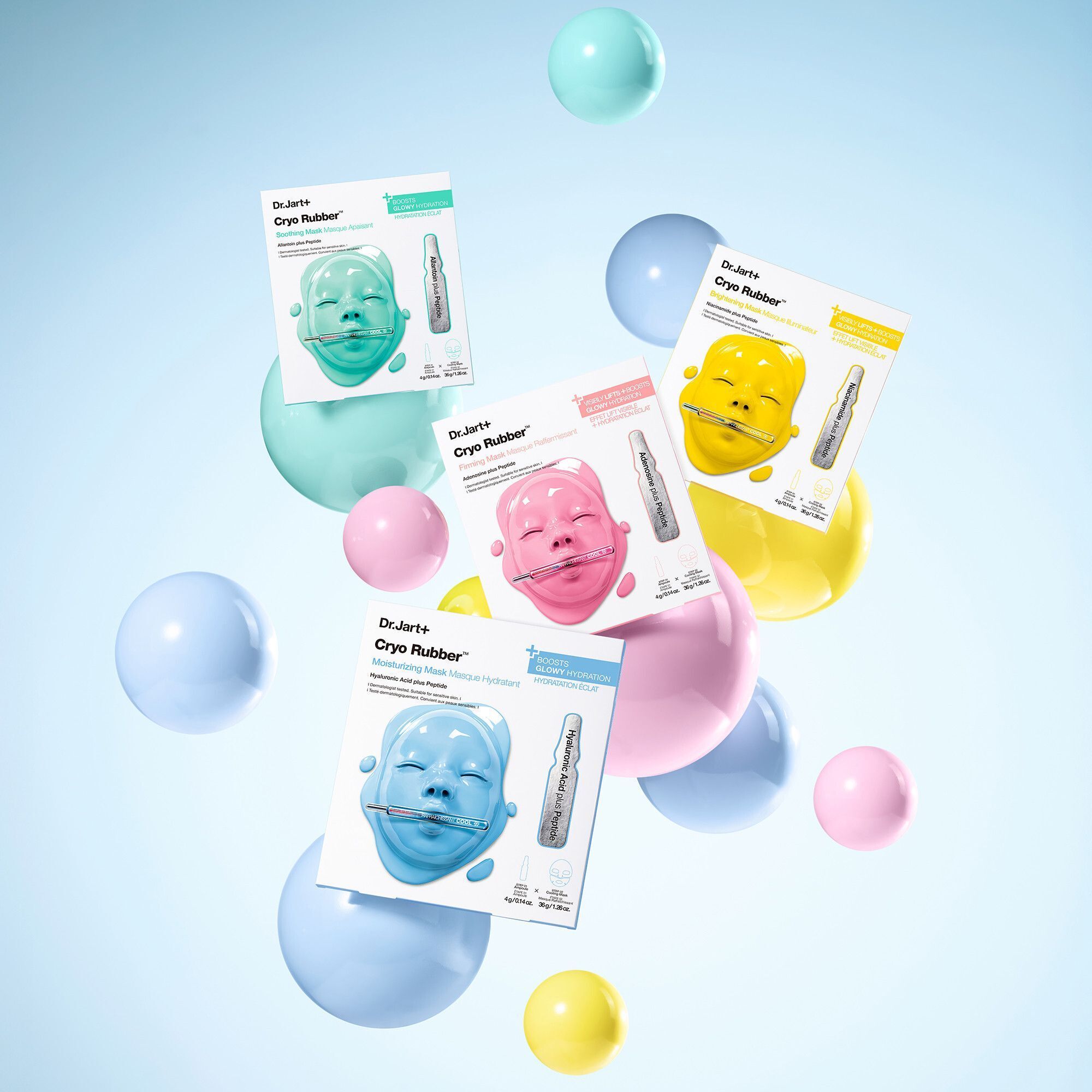 Quatre masques Dr.Jart+ Cryo Rubber™ flottant avec des sphères colorées.