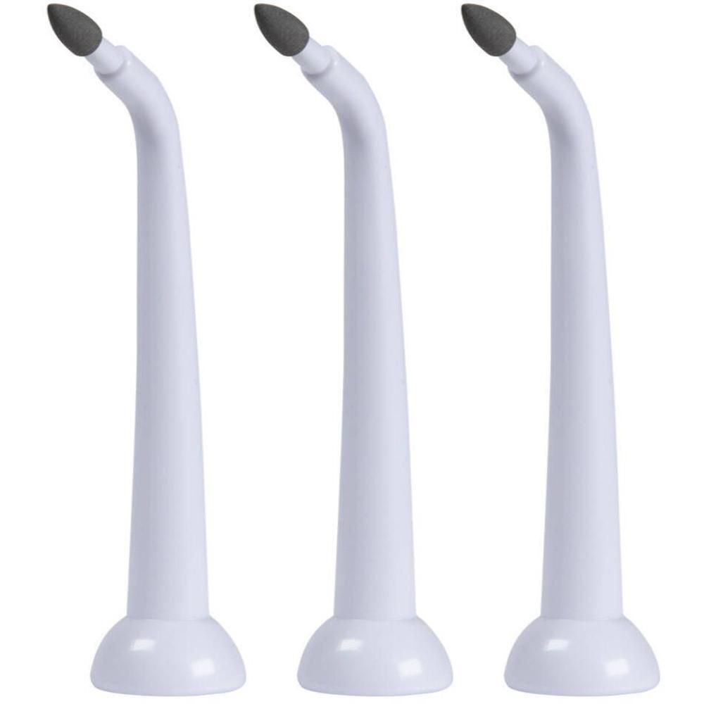 Trois embouts blancs courbés avec une pointe foncée pour un appareil de nettoyage dentaire.