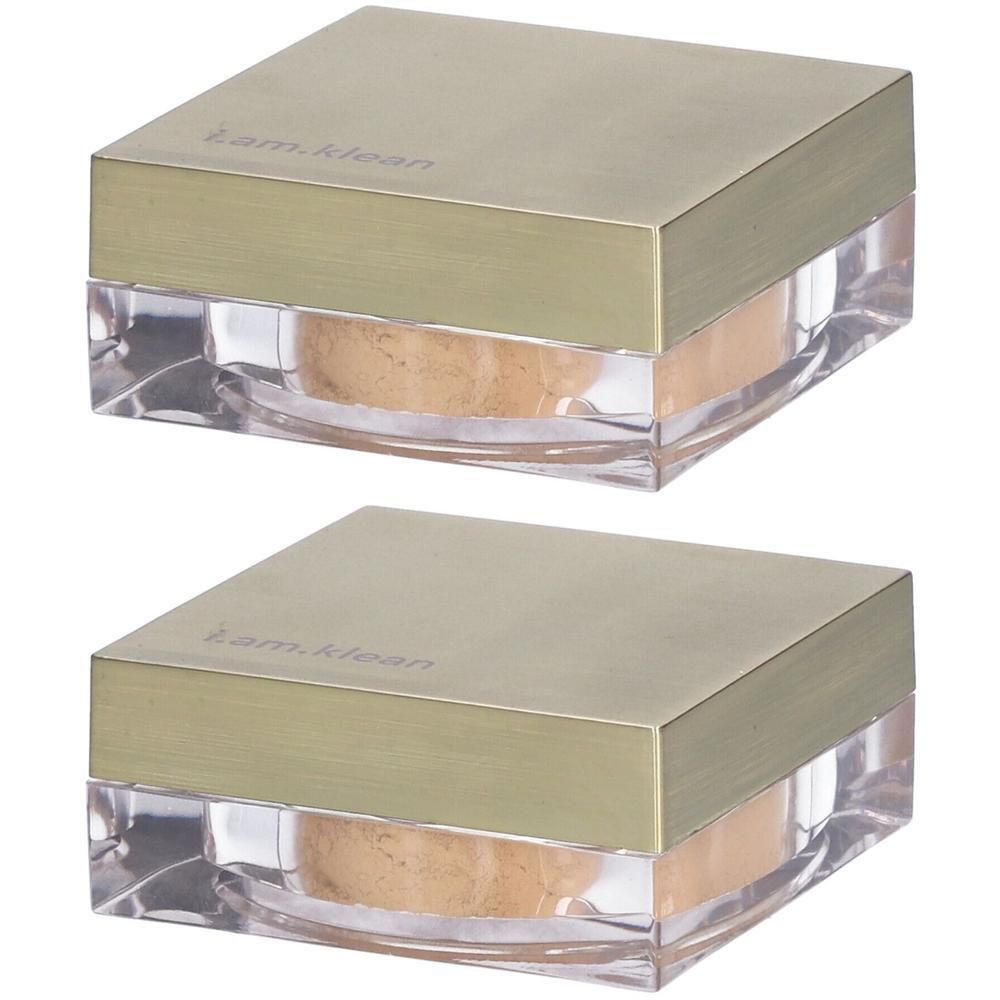 Twee potjes los minerale foundation in perzikkleur. Transparante potjes met gouden deksels.