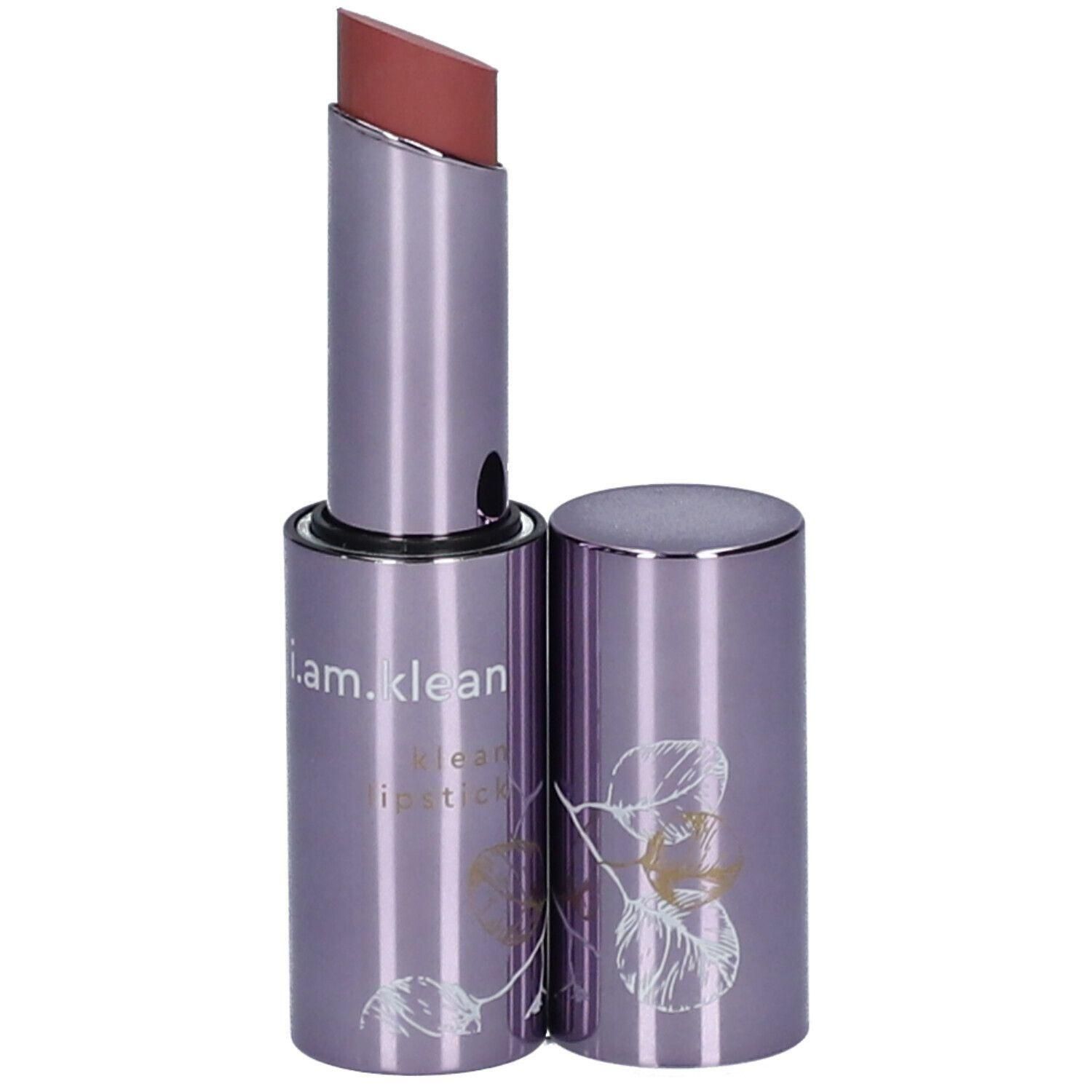 Rouge à lèvres violet avec boîtier argenté et motif de feuilles. Le rouge à lèvres est dévissé.