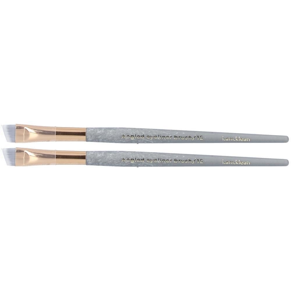 Deux pinceaux eye-liner biseautés avec manche gris et applicateur doré.