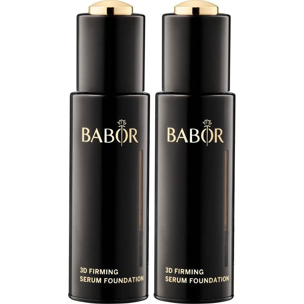 Twee zwarte flacons Babor 3D Firming Serum Foundation met gouden dopjes.