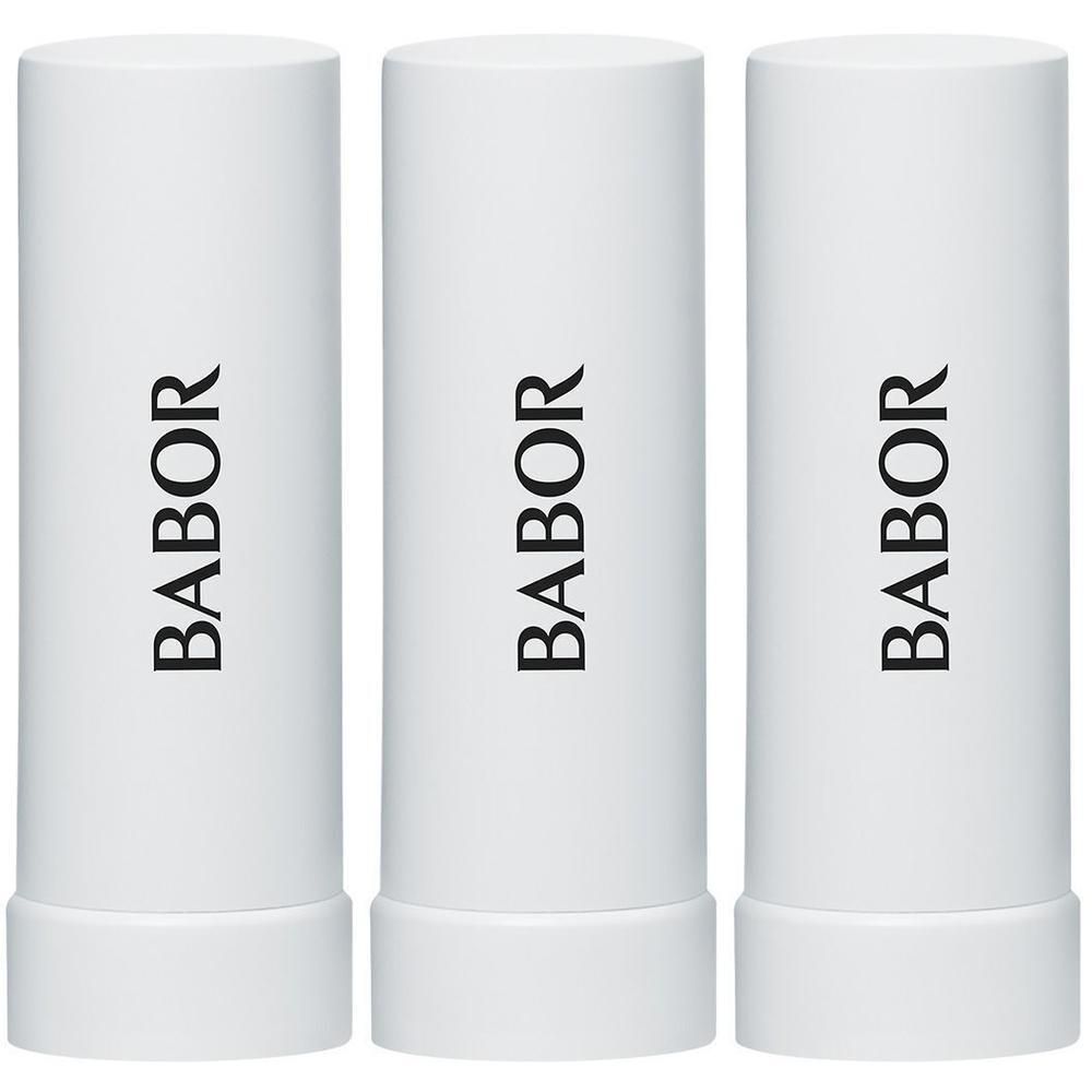Trois sticks de baume à lèvres Babor blancs côte à côte.