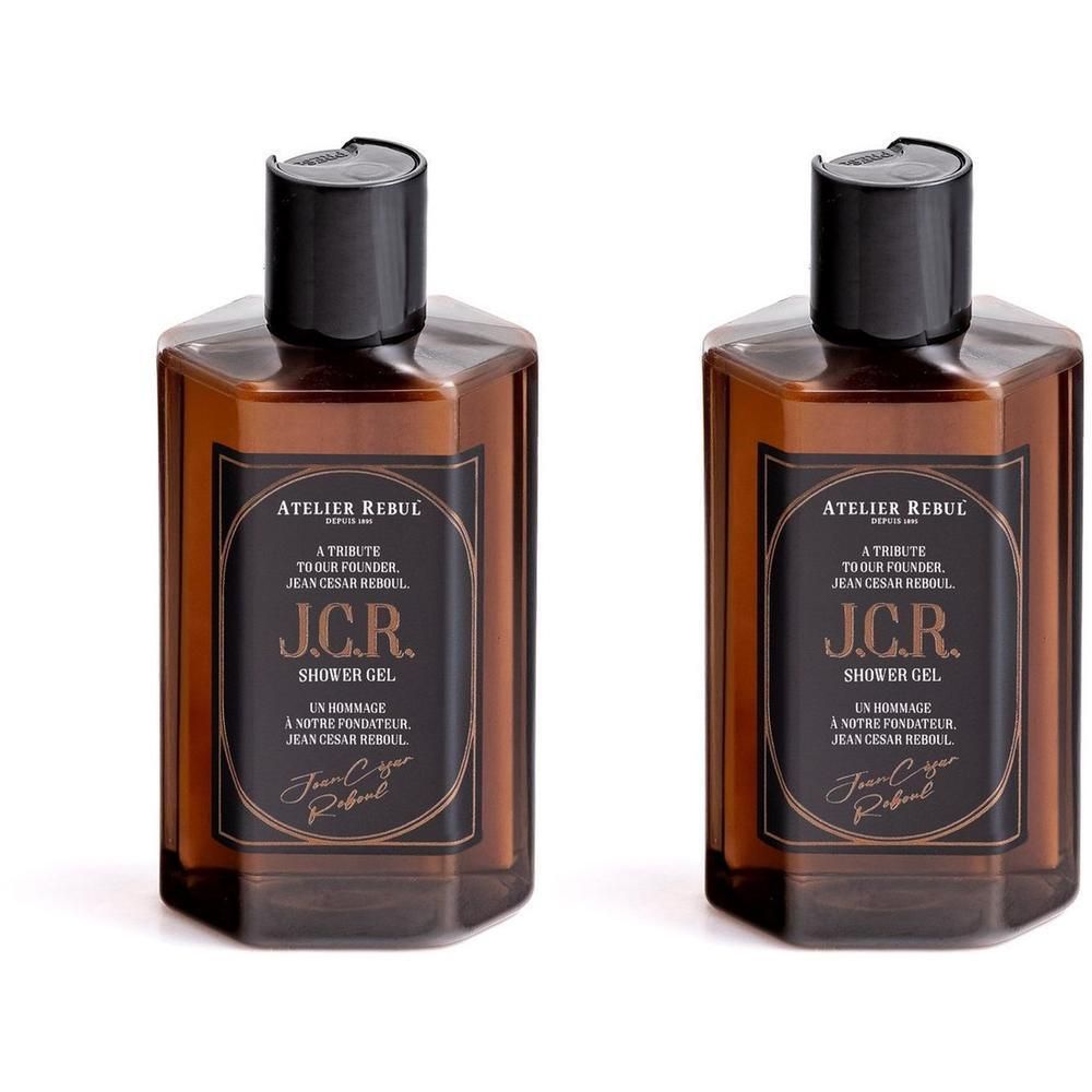 Deux flacons de gel douche Atelier Rebul J.C.R. avec étiquette marron et bouchon noir.