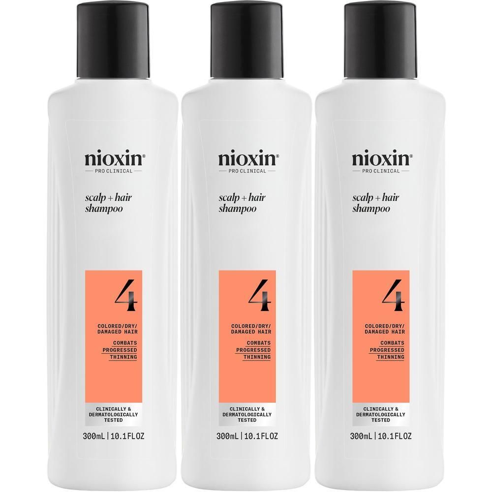 Trois bouteilles de shampooing Nioxin Système 4, blanches avec bouchon noir, pour cheveux colorés/secs.