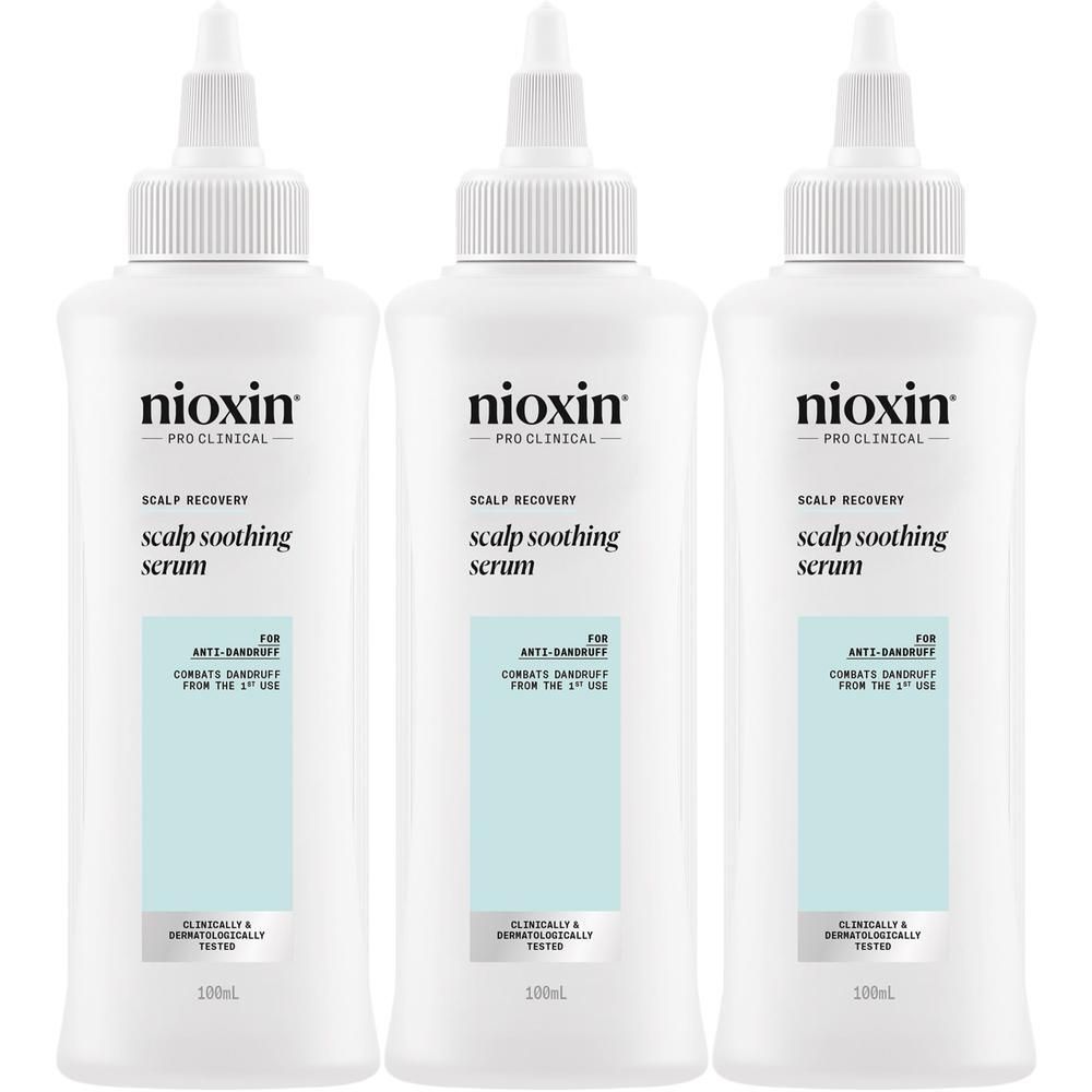Trois flacons blancs de sérum apaisant pour cuir chevelu Nioxin Scalp Recovery avec embouts applicateurs.