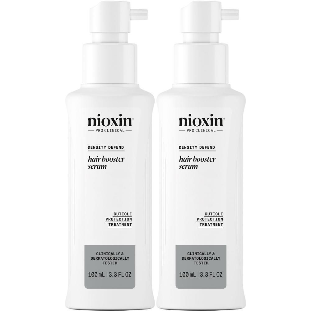 Twee witte pompflesjes Nioxin Hair Booster Serum, 100 ml.