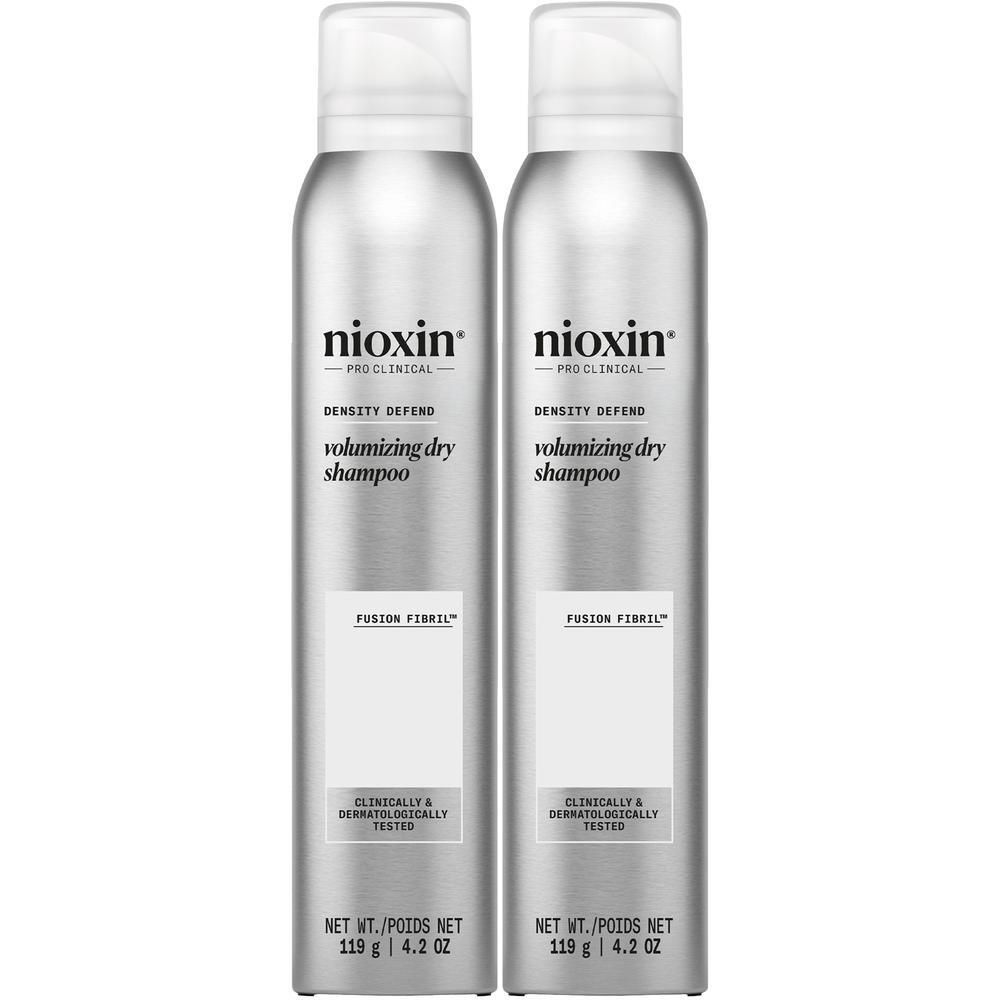 Twee Nioxin volumiserende droogshampoos in zilveren spuitbussen.