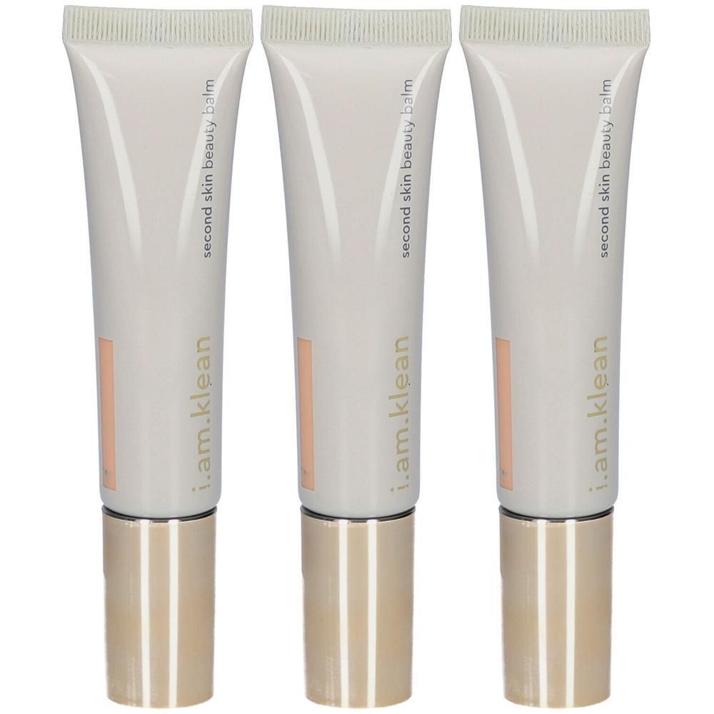 Trois tubes de "Second Skin Beauty Balm" avec bouchons dorés.