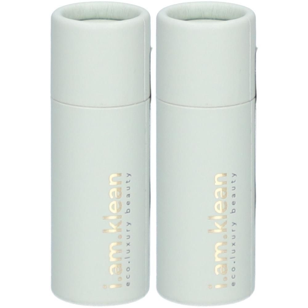 Twee witte buisvormige verpakkingen met gouden tekst 'i.am.klean eco.luxury beauty'.