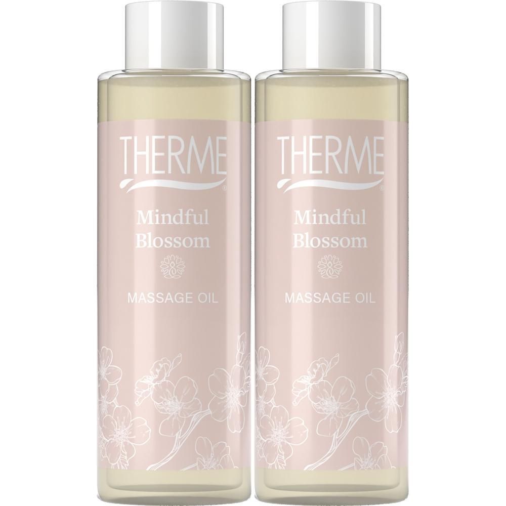 Deux flacons d'huile de massage Therme Mindful Blossom, bouchon blanc, étiquette rose.