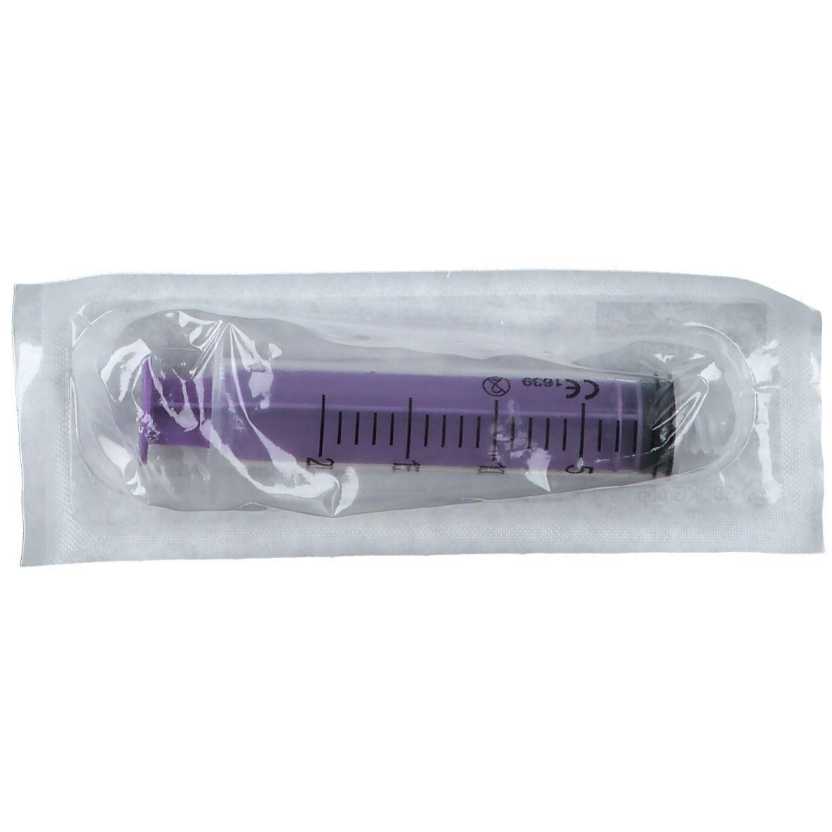 Seringue violette avec marquages en ml, marquage CE, sous emballage stérile.