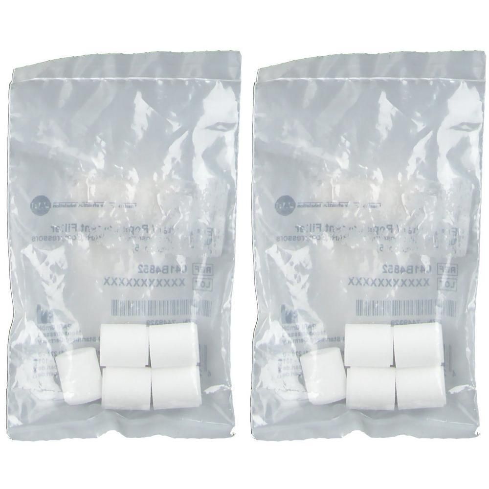 Twee zakjes met elk zes witte aerosolfilters. Filters zijn cilindrisch en individueel verpakt.