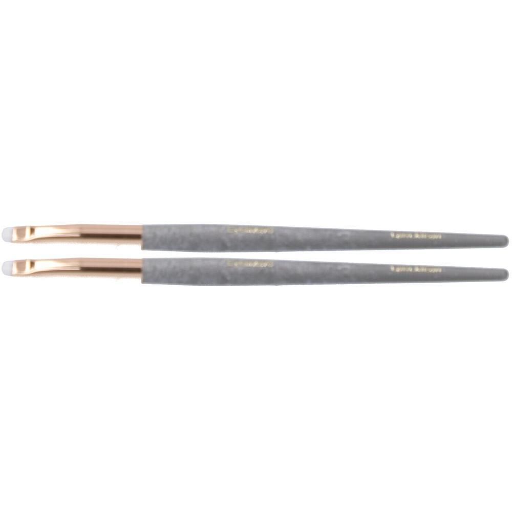 Twee grijze eyelinerkwasten met gouden applicators en witte puntjes.