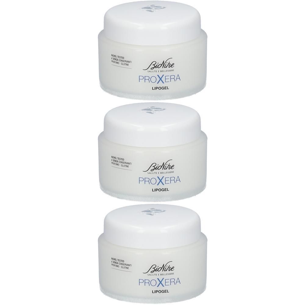 Trois pots de Bionike Proxera Lipogel avec couvercles blancs.