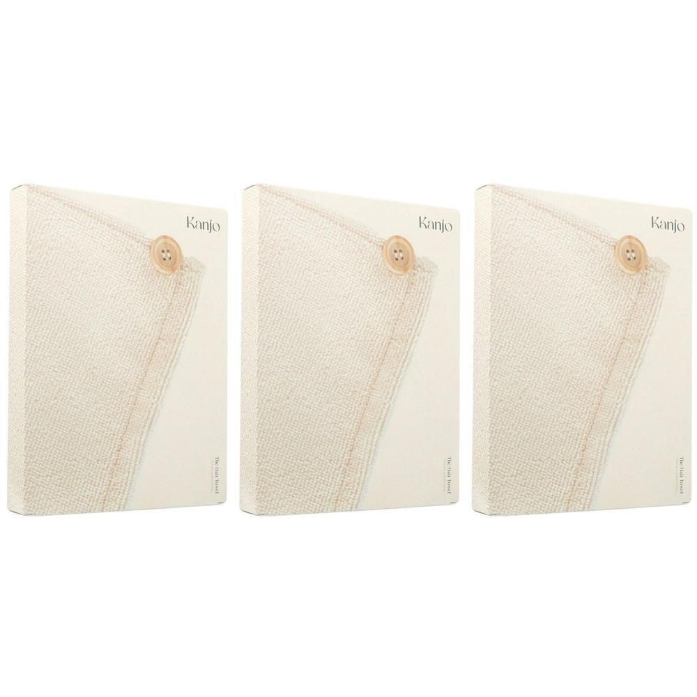 Trois serviettes pour cheveux Kanjo dans un emballage beige avec fermeture à bouton.
