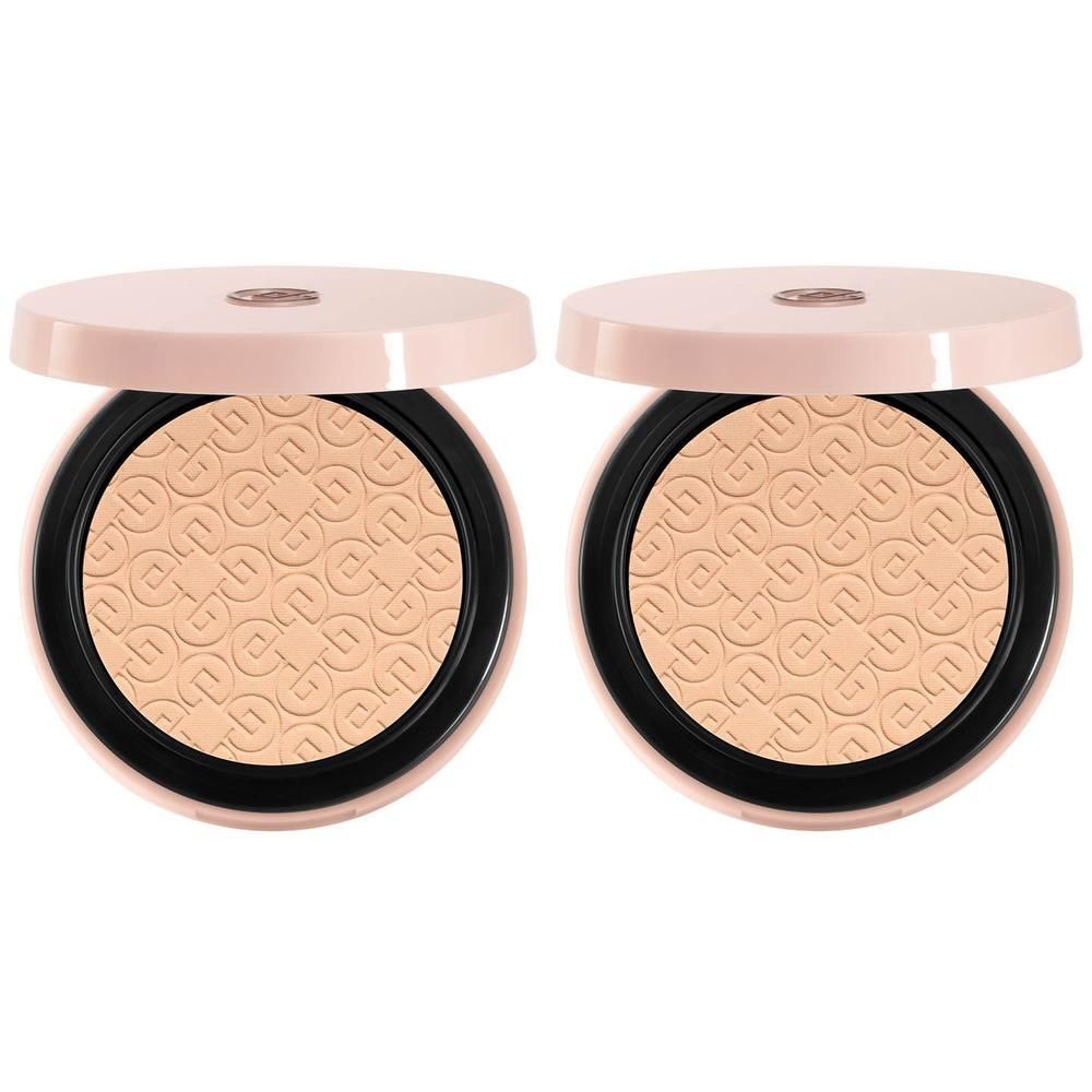 Deux boîtes de poudre compact ouverte, poudre beige avec motif en relief.