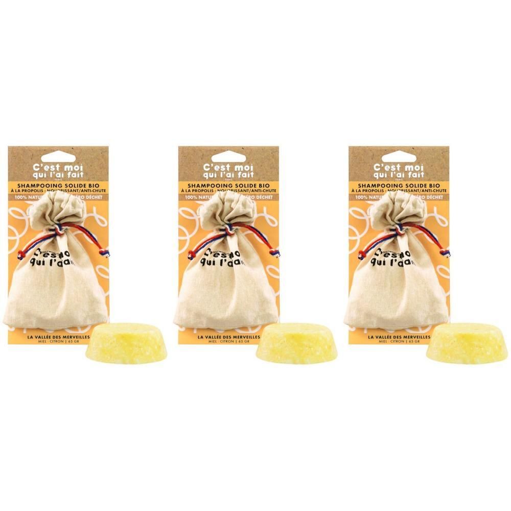 Drie vaste biologische shampoos met propolis in zakjes op kaarten.