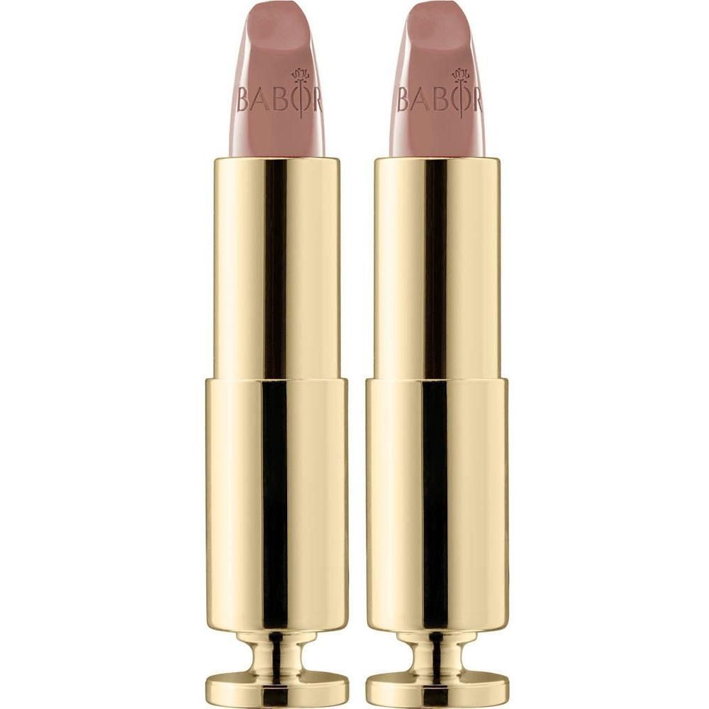 Twee gouden lippenstiftkokers met lichtroze lippenstift.