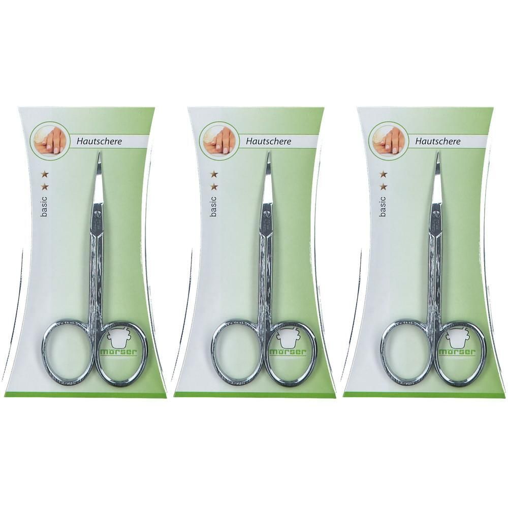 Drie zilverkleurige huidsschaartjes in individuele verpakking. De schaartjes hebben een gebogen punt en zijn van metaal.