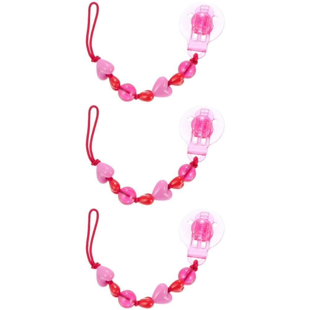 Trois attaches sucette avec perles cœur roses et rouges et un clip transparent.