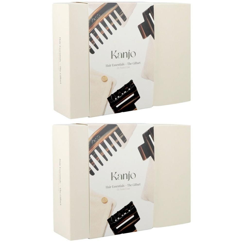 Deux coffrets cadeaux Kanjo Hair Essentials avec pinces à cheveux et peigne sur l'emballage.