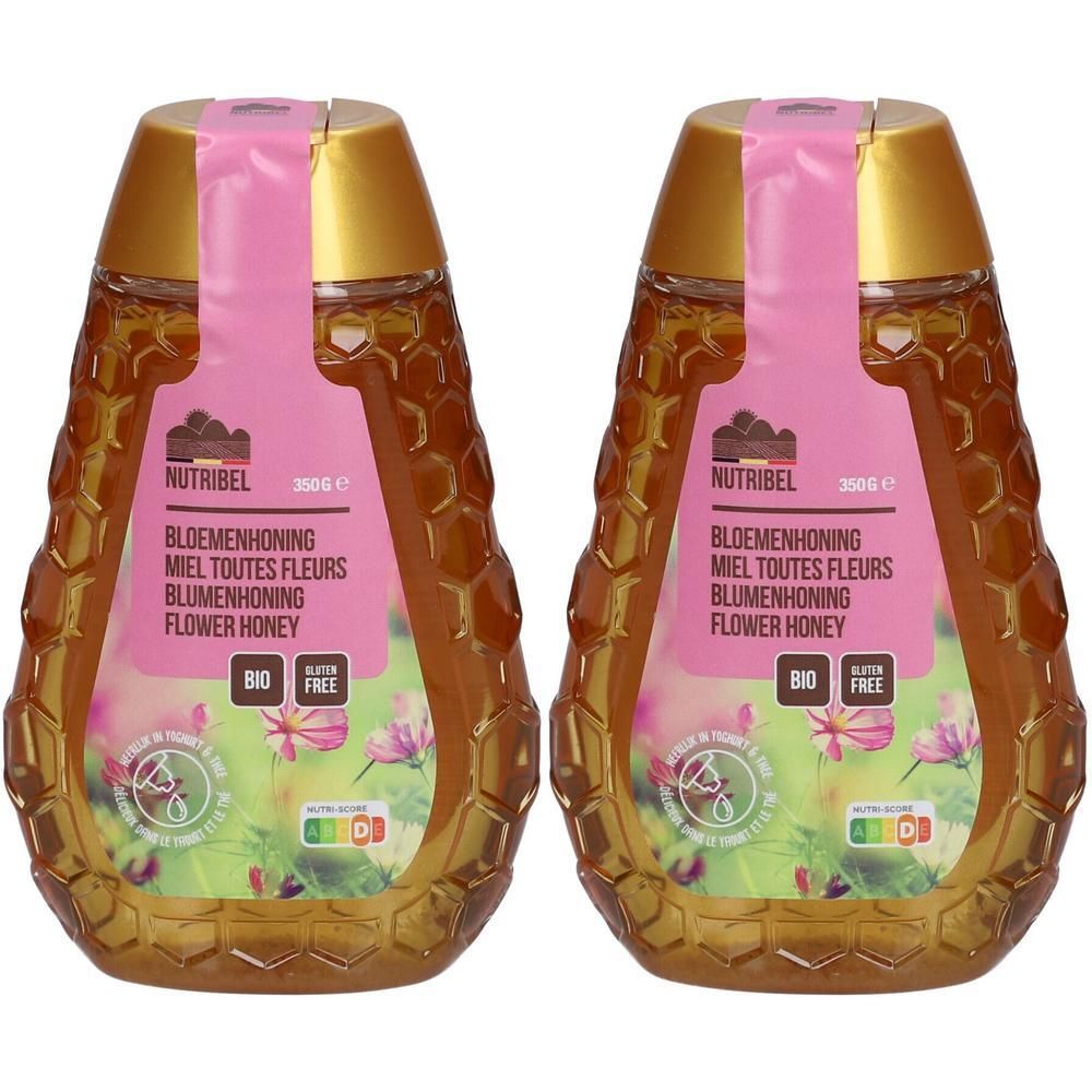 Twee flessen Nutribel bloemenhoning met etiketten die Bio- en Glutenvrij-zegels tonen.