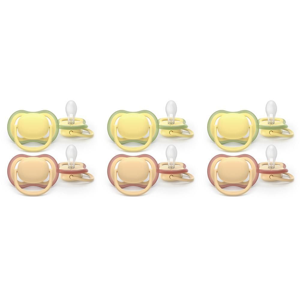 Trois paires de sucettes, une jaune/verte et deux rose/beige.